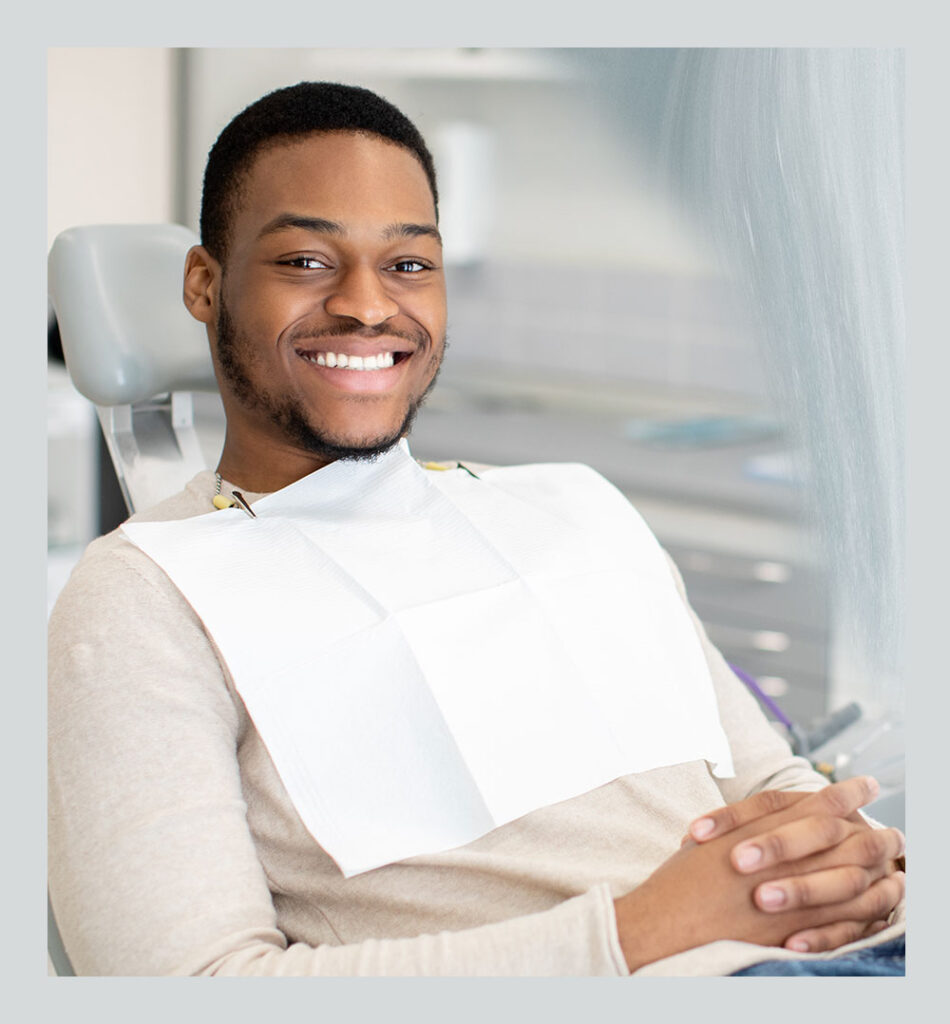 young man in dental chair for wisdom tooth removal