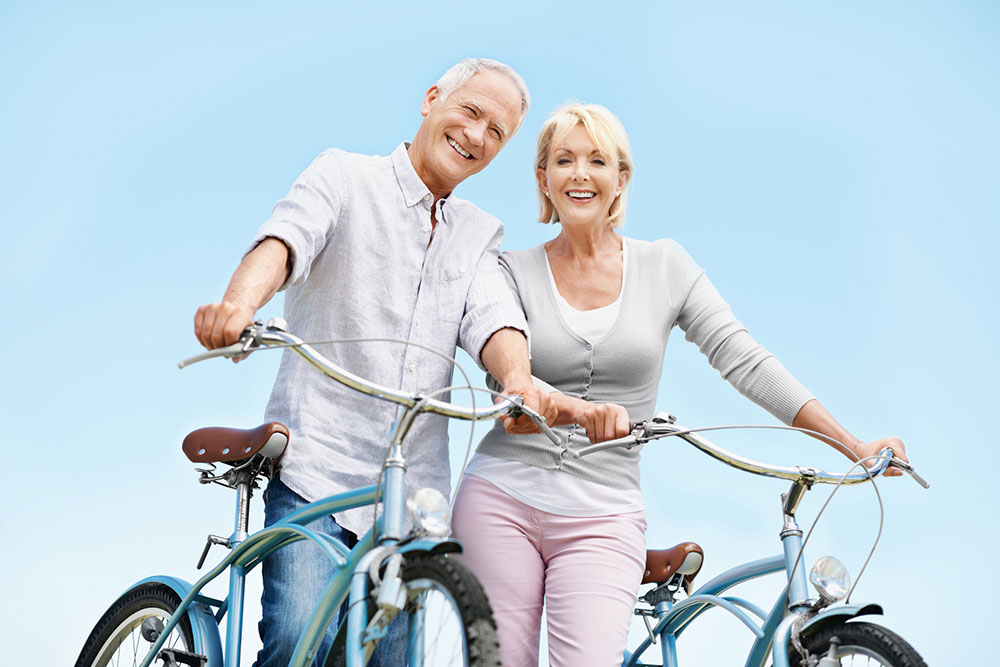 senior couple on bikes